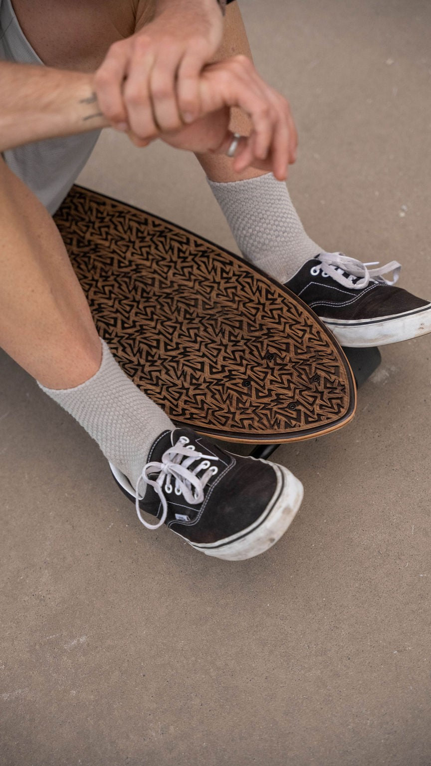 Man sitting on skateboard