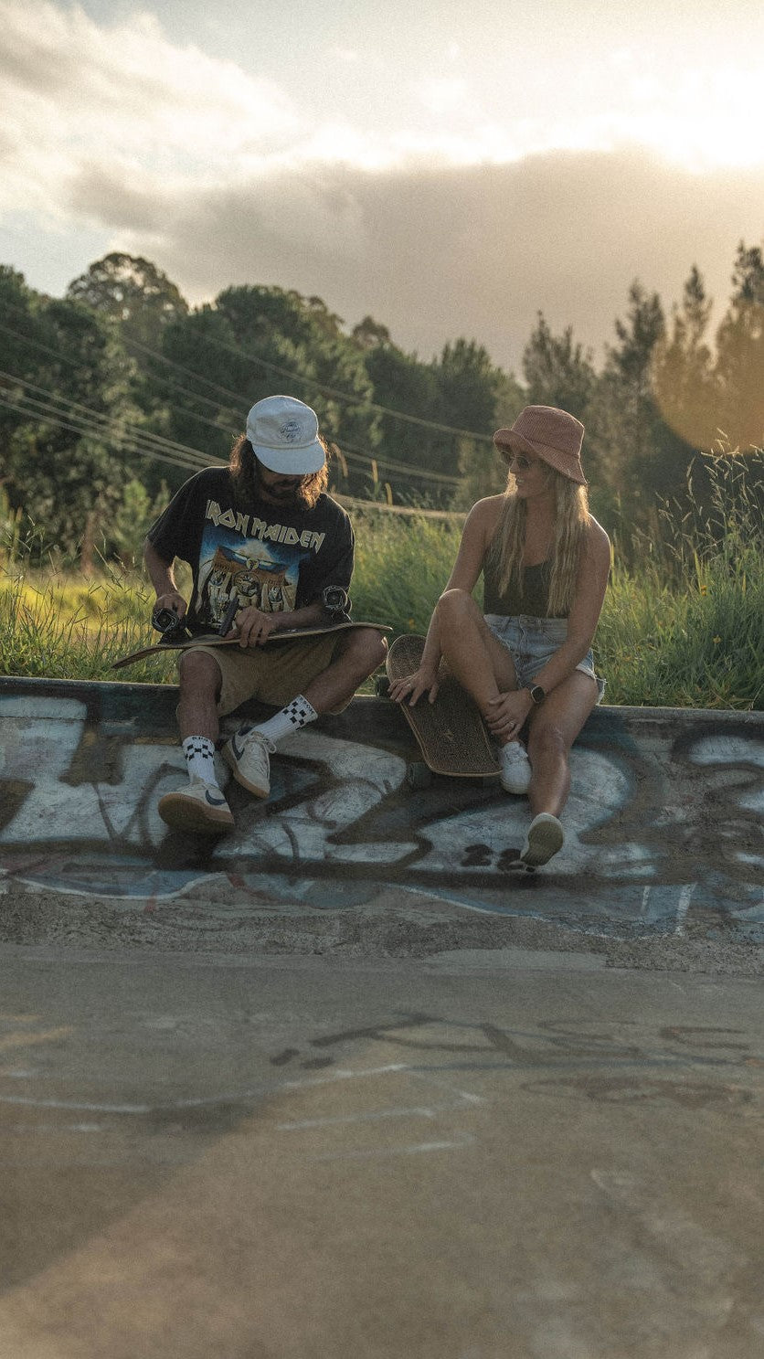 Man examining skateboard