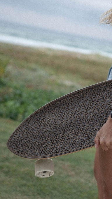 woman carrying skateboard